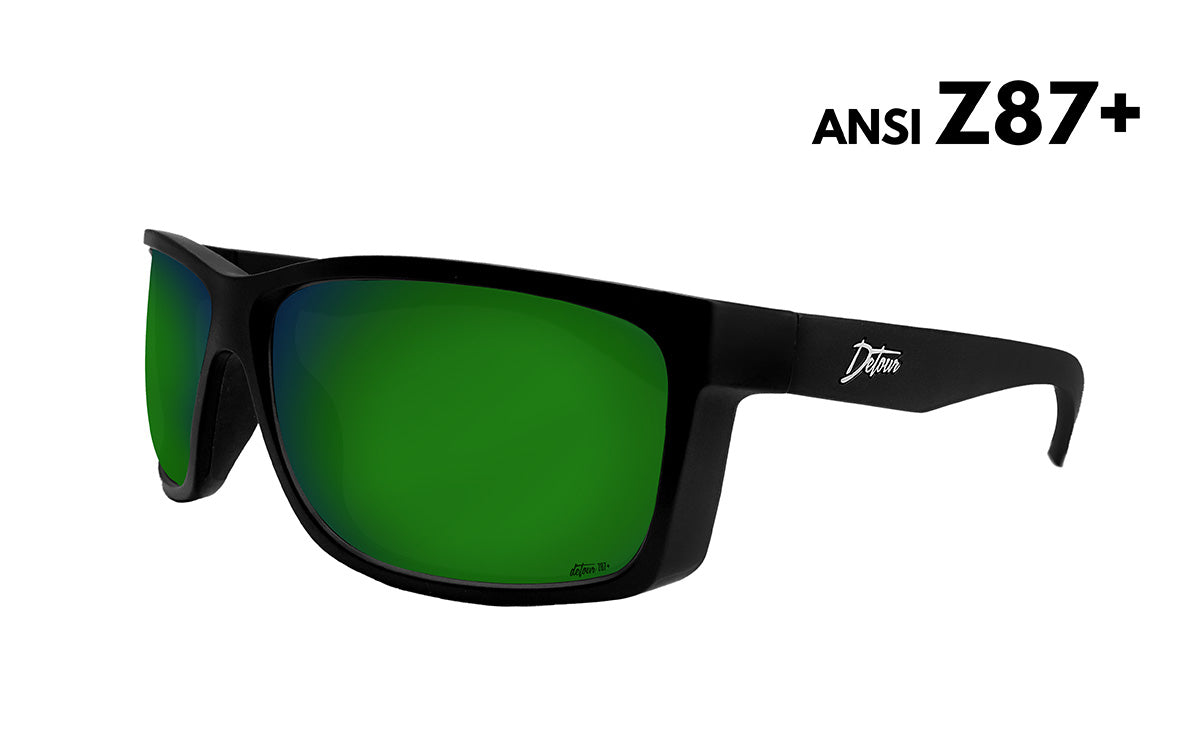 Black sunglasses with green-tinted lenses.