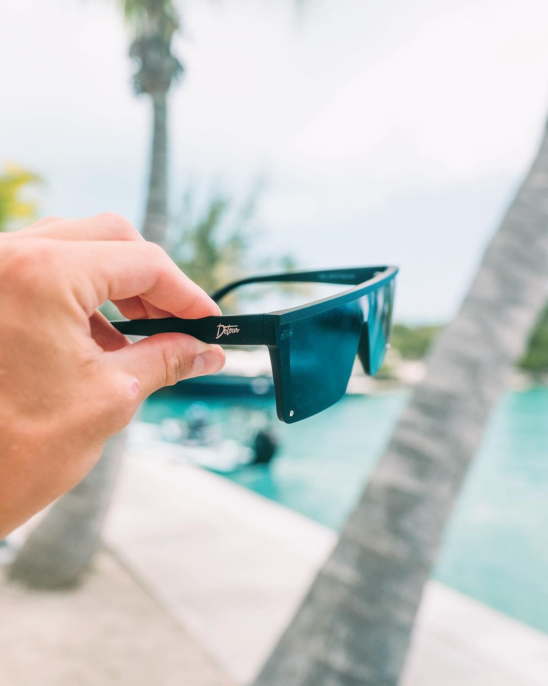 Snowboarder carving through powder in snowy terrain.